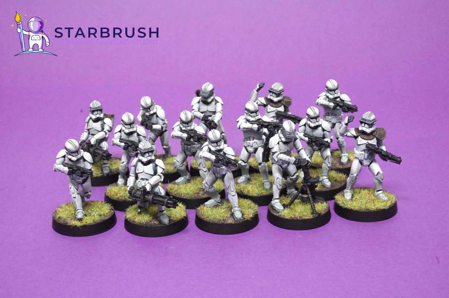 Full formation of 14 Phase II Clone Troopers on green meadow bases painted to Level 4
