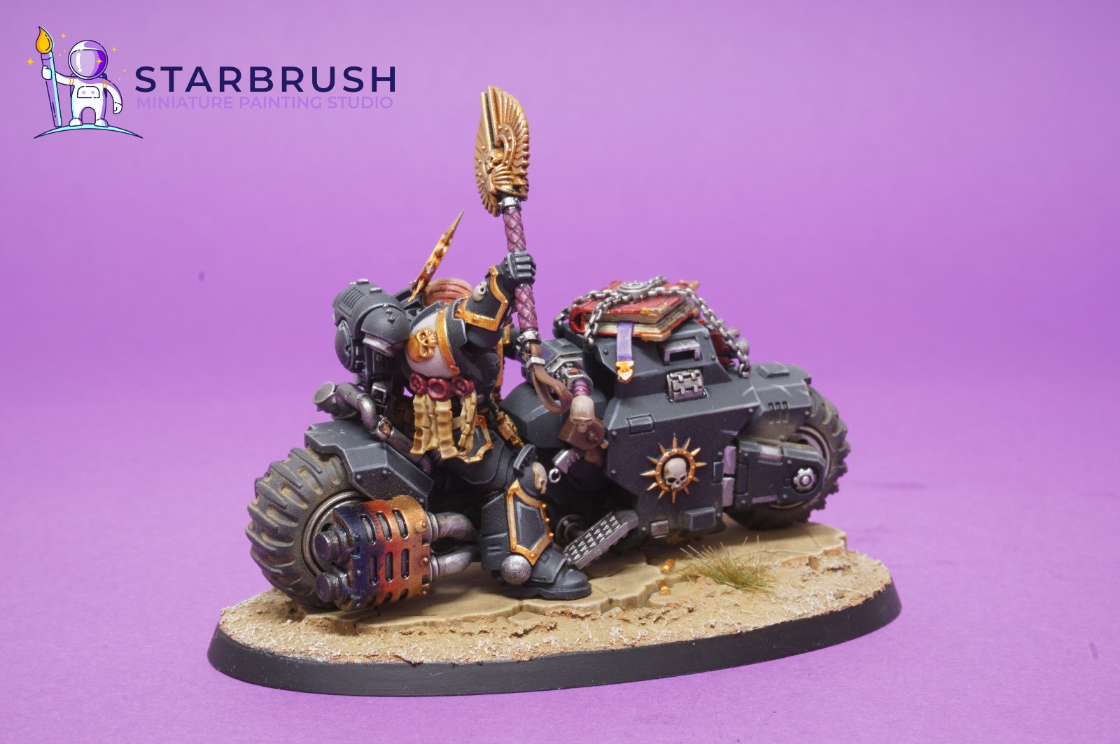 Sacred tomes chained to the edge-highlighted black armour of a Primaris Chaplain on Bike painted to Level 3